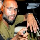 Saif al-Islam, seen here speaking to reporters in Tripoli last month, has promised continued...