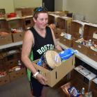 Salvation Army Dunedin volunteer Mel Carter with a Christmas hamper for an individual. Photos by...