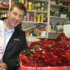 Salvation Army Queenstown community manager Blair McKenzie with some of the food gathered by...