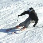 Sam Hazeldine speeds around a banked turn while training on the ski-cross course at Cardrona...