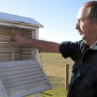 Sam Leask checks the temperature at the Niwa field station in his yard at Ophir. Photo by Sarah...