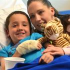 Sam Stainer, with mother Sandra, recovers in the children's ward at Dunedin Hospital after having...