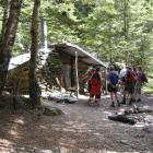 Sam Summers hut, where a short side track below leads to a rock fissure once used as a tail race....