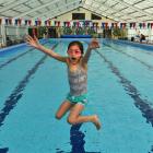 Samantha Kirkman (10) dives into the Port Chalmers Pool during a community gathering yesterday to...