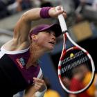 Samantha Stosur of Australia serves to Serena Williams of the US during their final at the US...