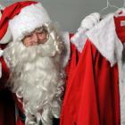 Santa prepares for the up-coming Christmas season by sorting out his helper's costumes. Photo by...