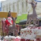 Santa takes his new sleigh down Thames St, Oamaru. Photo by Andrew Ashton.