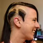 Sarah Naylor shows off the walrus-style moustache shaved out of  her hair yesterday in memory of...