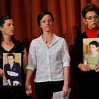 Sarah Shourd (centre), stands with Cindy Hickey (left), mother of Shane Bauer, and Laura Fattal,...