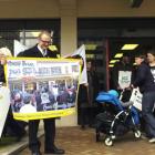 Save Dunedin Metro Post Shop and Kiwibank campaign spokesman Victor Billot prepares to send a...