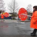 Sawyers Bay School principal Gareth Swete (left) and school patrollers Ethan Aitcheson (9) and...