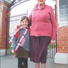 School mates: Abbey Collins (4) is held close by her greatgrandmother Thelma Howison, who...