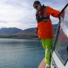 Scientist Heidi Roop recovers scientific data sensors at Lake Ohau. Photo supplied.