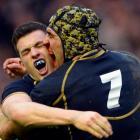 Scotland's Matthew Scott and Kelly Brown (R) celebrate their victory against Ireland in their Six...