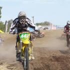 Scott Columb pushes to get ahead during the supercross competition in Timaru yesterday. Photos by...