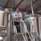 Scotts Brewing Co owner Phillip Scott, of Oamaru, views the brewery's new enlarged operation at...