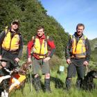 Search dog team (from left) Mark Allen, of Twizel, Dave Krehic, of Christchurch, and Brent...