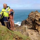 Senior Constable Lox Kellas, of Portobello, with part of the newly-installed life ring casing...