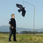Senior Firefighter Bruce Smaill checks one of six "eagles" helping protect passenger aircraft...