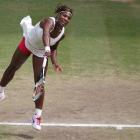 Serena Williams serves to Petra Kvitova of the Czech Republc, during their women's singles...