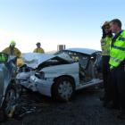 Sergeant Bruce Martin (left), of Alexandra, and Luggate firefighter Scott Challis discuss the...