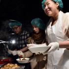 Serving sweet and sour pork at the Dunedin International Food Festival on Saturday were (from...
