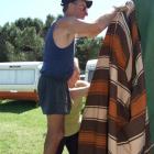 Setting up the awning for their Mosgiel friend Dorothy Rolleston's caravan at the Clyde camp are ...