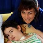 Shania Hutton shows she is on the road to recovery by giving the thumbs-up with mother Jane, in...