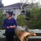 Shannon Swann outside her Christchurch house which was struck by a tree in last night's storm....