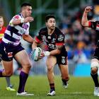 Shaun Johnson runs the ball up for the Warriors against the Storm. Photo Getty