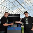 Shed 152 Brewery owners (from left) Chris Henderson and Dave Gibson take a break after setting up...