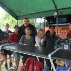Sheltering at Waitangi yesterday are Michael Richardson, Lewey Richardson (14), Rebecca...