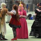 Shinrii Sato, of Christchurch, adjusts the outfit of Natasha Bantuel, of Napier, as Emma...