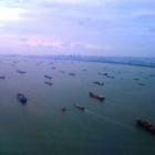 Shipping in Singapore lies idle at anchor because of dwindling global cargo volumes.