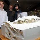 Showing a model of their latest building project in China are (from left) graduate architect...