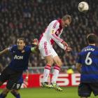 Siem de Jong of Ajax Amsterdam heads the ball between Rio Ferdinand (L) and Jonny Evans of...