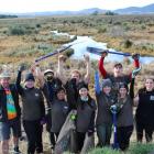 Sinclair Wetlands co-ordinator Glen Riley (left) with a group of voluntourists giving a fortnight...