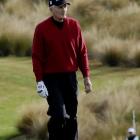 Sir Bob Charles walks down the fairway on the 14th hole on Thursday at the Michael Hill NZ Open....