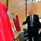 Sir Graham Henry unveils the foundation plaque;  the new $4 million centre.