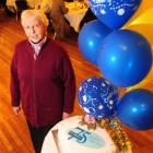 Sister Barbara Ferguson, pictured with the commemorative cake, enjoys Mercy Hospital's 75th...