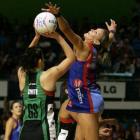 Mystics defender Leana de Bruin (right) stretches out against Nikala Smith, of the Fever, during...