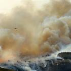Smoke from a fire near Dunback billows high in the sky yesterday. Photo by Stephen Jaquiery.