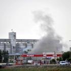 Smoke rises at the Akcakale border gate after a shell fired from Syria landed on the Turkish...