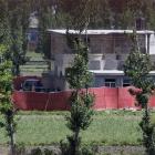 Soldiers from Pakistan's army are seen near the house in Abbottabad, Pakistan, where it is...