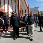 Solemn procession out of Te Whare Tamatea at a funeral at Otakou marae yesterday for Marty...