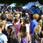 Some of this year's 25,000 students  look at what is on offer at the Museum Reserve yesterday as...