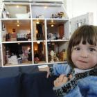 Sophie Marsh (2) takes in Margaret Todd's miniature house at the Dunedin Miniaturists Club open...