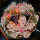 Sophie Warner, of Winton, takes a closer look at a Mirror Magic interactive exhibit at  Otago...