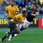 South Africa's Pierre Spies closes in on Wallabies halfback Will Genia.REUTERS/Mike Hutchings