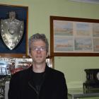 South Otago Museum curator Gary Ross with the Lawes Challenge shield and  six restored paintings...